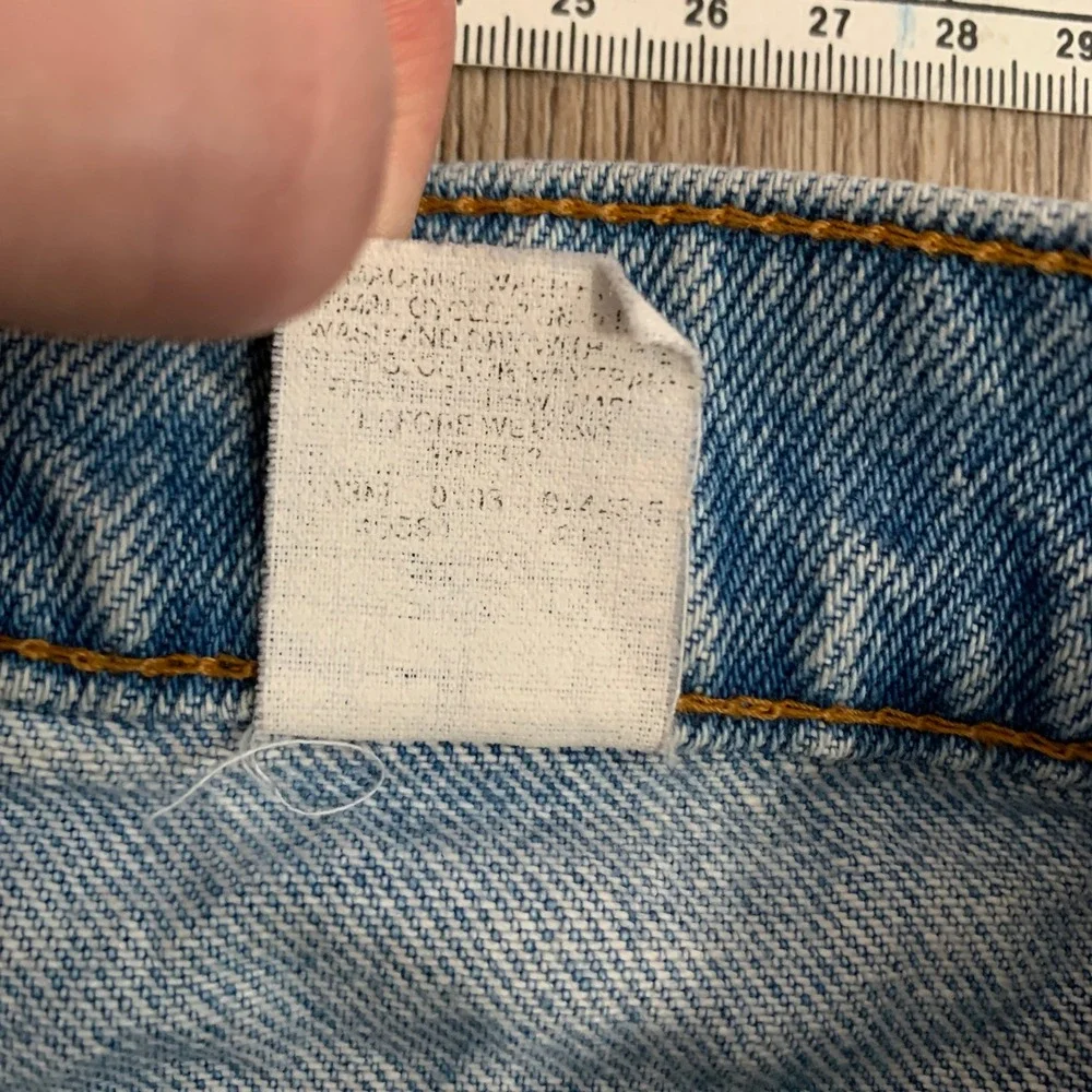 Vintage 80s Levi's 550 orange tab tapered leg denim jeans in light wash - 30x30‎